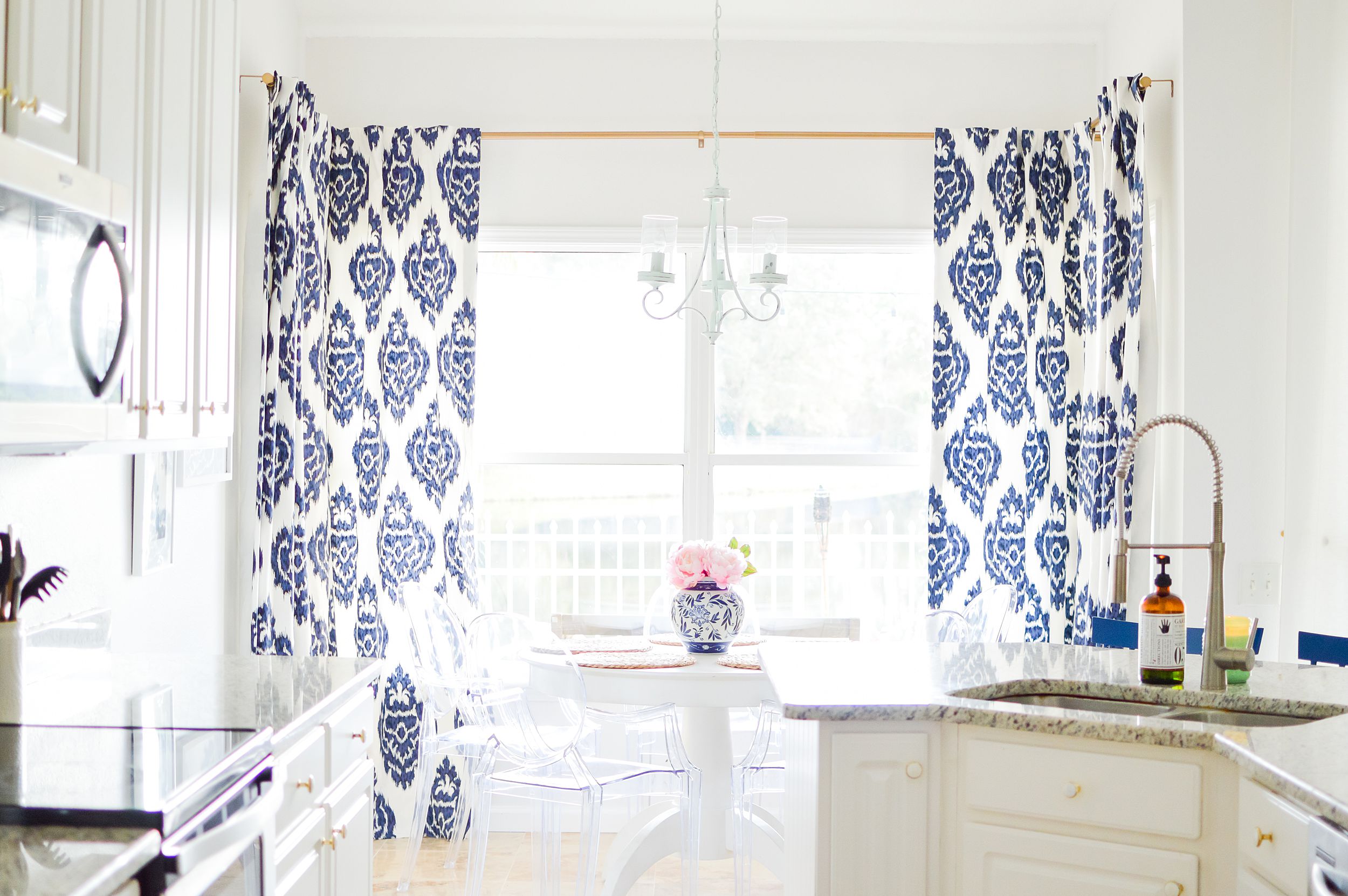 navy ikat curtains in an all white kitchen