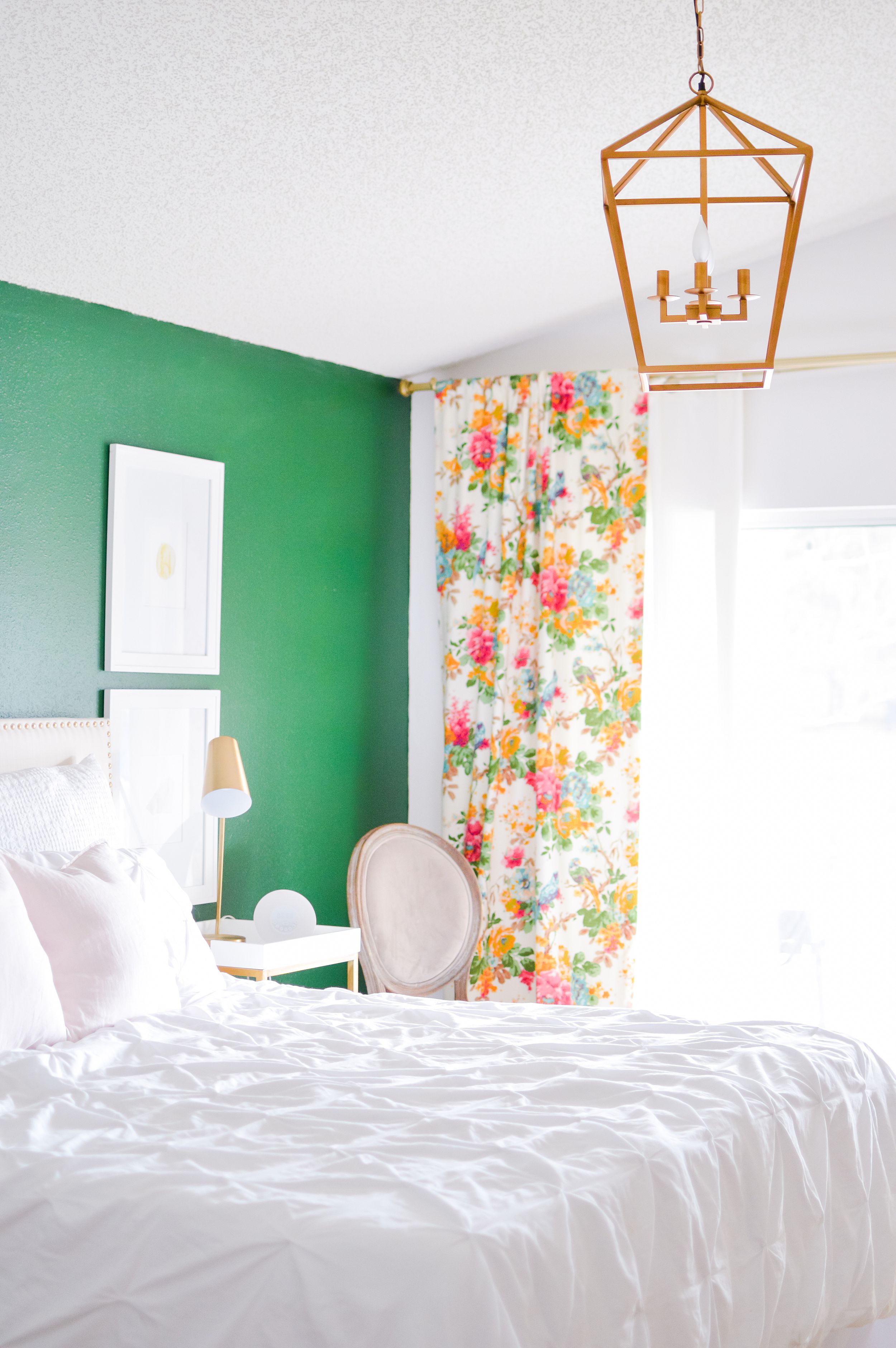 emerald green accent wall in master bedroom