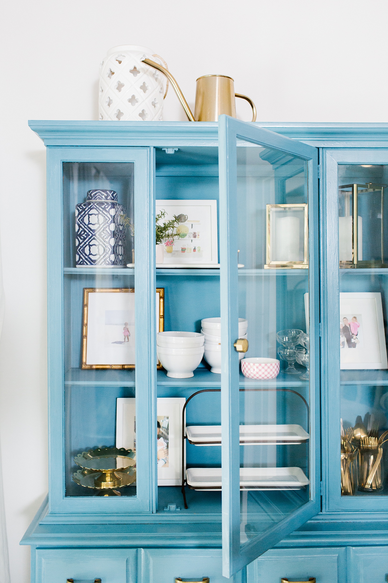 A vintage hutch in blue! Chalk paint, Amy Howard Home Rugo, bright white kitchen, gold white and navy kitchen, anthropologie knobs, Megan Martin Creative